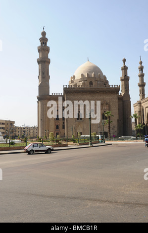 Sultan Hassan Mosque on left and later built El Rifai Mosque on right seen from midan al qala'a, egypt cairo Stock Photo