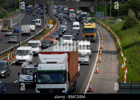 Bank holiday traffic near Luton. Coned off hard shoulder with no roadworks going on whilst new UK government decides priorities. Stock Photo