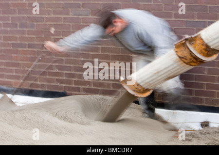 Pouring concrete for the floor of a house extension, Ambleside, UK. Stock Photo