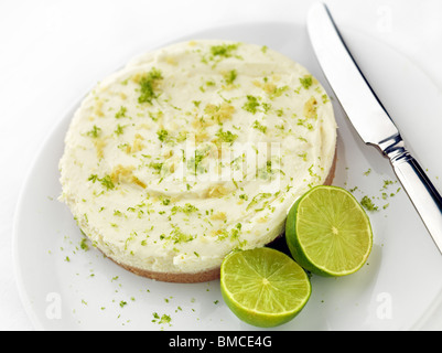 Key Lime pie with sliced limes Stock Photo