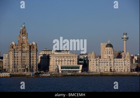 three graces building and mersey ferry terminal liverpool waterfront shoreline merseyside england uk Stock Photo
