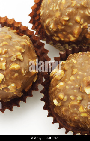 Nut in dark chocolate balls sweet candy Stock Photo - Alamy