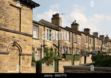 A row of terraced houses in Sir Titus Salt's model village Saltaire, near Bradford, West Yorkshire, England, UK Stock Photo