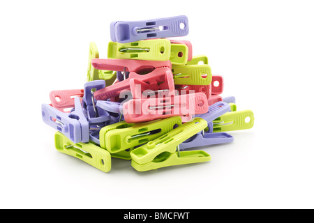 Pile of colorful plastic pegs on white background Stock Photo