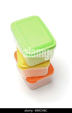 Stack of three plastic storage boxes on white background Stock Photo