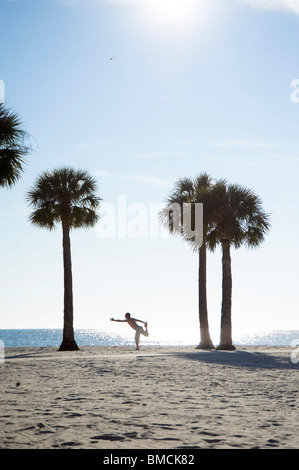 Man Practicing Yoga on Beach, Hernando Beach, Florida, USA Stock Photo