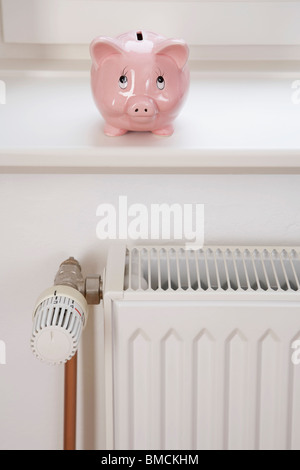 Piggy Bank and Radiator Stock Photo