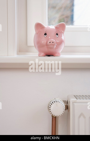 Piggy Bank and Radiator Stock Photo