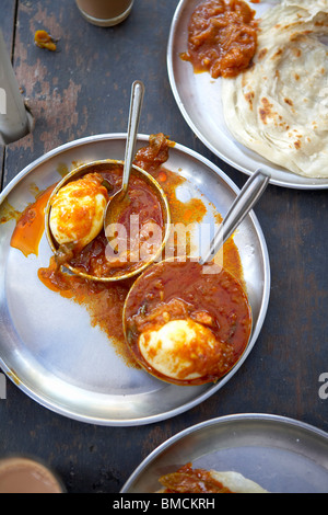 Hard Boiled Eggs With Masala and Paratha Bread, Kochi, Kerala, India Stock Photo