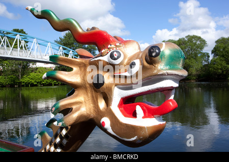 Dragon boat racing on the River Nith Dumfries close up of Chinese dragon head at prow of boat UK Stock Photo