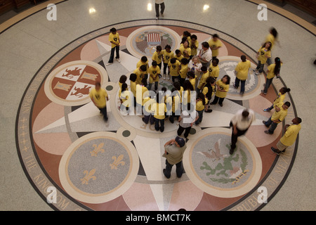 School children looking at middle seal on floor of Texas state capitol building rotunda in Austin Stock Photo