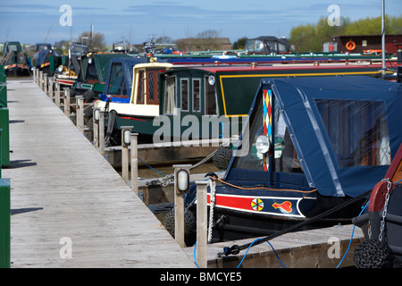 traditional english narrow and wide canal boats moored at scarisbrick marina near fettlers wharf marina liverpool leeds canal Stock Photo