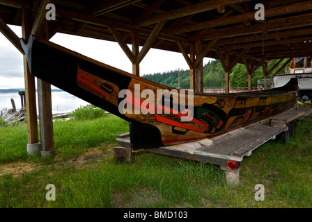 Decorated carved ceremonial wooden war canoe Cape Mudge Village native reserve south Quadra Island BC Stock Photo