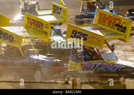 formula 2 stock cars corner on an oval race track Stock Photo