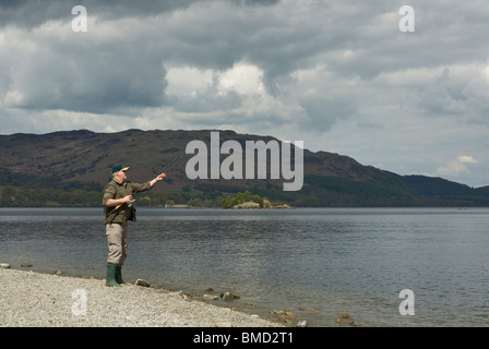 Angler fishing in Ullswater, Lake District National Park, Cumbria, England UK Stock Photo