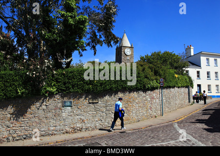 High Street and the tower of the Old Church, St. Anne Alderney, Channel Islands, United Kingdom Stock Photo