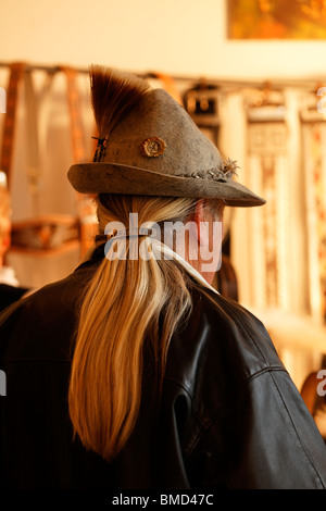Man with Long Hair Wearing a Gamsbart, Traditional Bavarian Dress Hat, Upper Bavaria Germany. Stock Photo