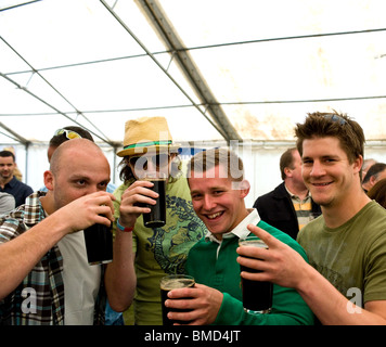 Four male customers enjoying themselves at the Hoop Beer Festival in Essex Stock Photo