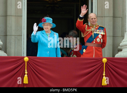 Britain's Queen Elizabeth and Prince Philip wave from the balcony of Buckingham Palace after the Trooping of the Colours