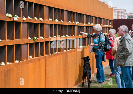 Wall with photos of victims at the Berlin Wall Memorial in the Bernauer Strasse, Berlin, Germany Stock Photo
