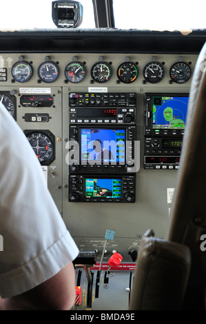 Instrument panel of a Mokulele Airlines light aircraft flying from M aui to Big Isl and, Hawaii, USA with satellite navigation Stock Photo