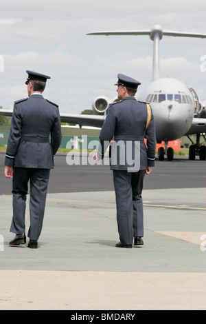 Officers walk on toward a VC10 transport plane newly arrived from the RAFs last tour of duty in Iraq. Stock Photo