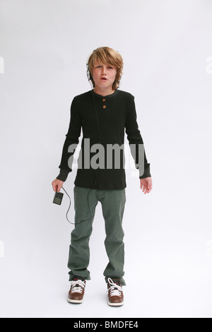 Boy with ipod against white background Stock Photo