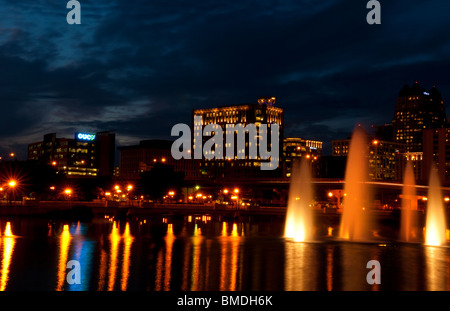 Orlando Florida Skyline at night taken from Lake Lucerne looking north with beautiful fountains lit in the evening Stock Photo