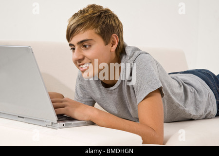 Teenage Boy Using Laptop Stock Photo