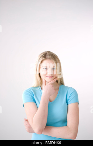Woman with Hand on Chin Stock Photo