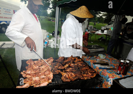 Caribbean jerk chicken on the barbecue at Reading carnival 2010. Stock Photo