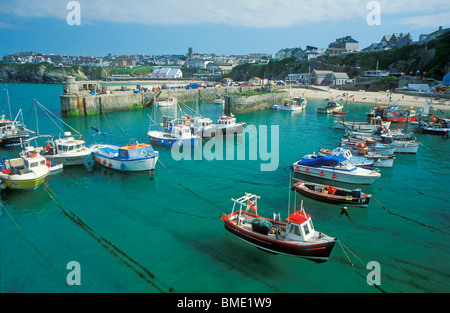 Clear turquoise water of Newquay harbour with small fishing boats moored North Cornwall coast England UK GB EU Europe Stock Photo