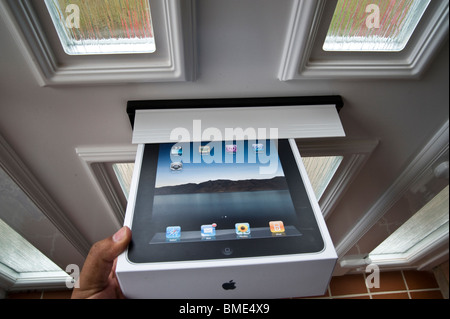 The long awaited Apple iPad is delivered by post. Stock Photo