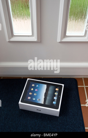 The long awaited Apple iPad is delivered by post. Stock Photo