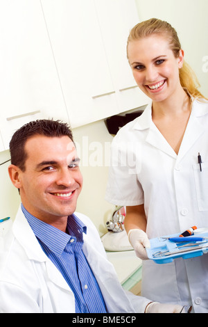 friendly dentist and dental assistant Stock Photo