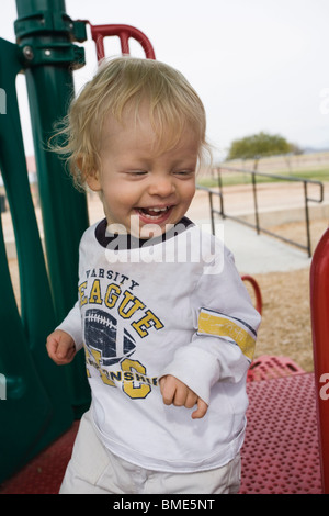 Happy 15 month old boy on playground. Stock Photo