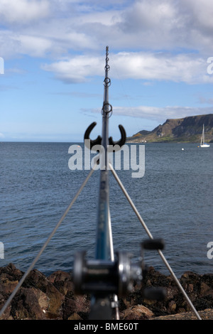 Shakespeare fishing rod and reel resting on sandy beach Stock Photo - Alamy