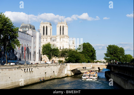 Boat in river near cathedral Stock Photo