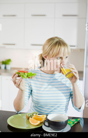 Woman having breakfast, Sweden. Stock Photo