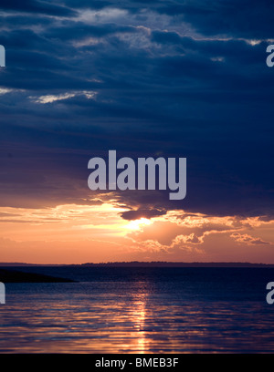 Scenic view of sun setting over sea Stock Photo