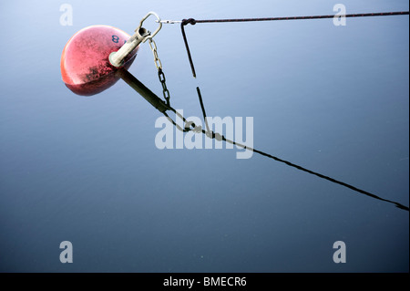 Buoy floating on water Stock Photo