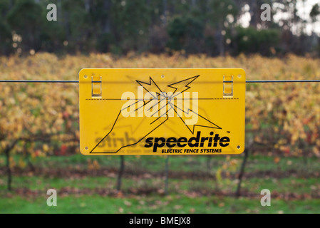 Electric fence warning sign Stock Photo