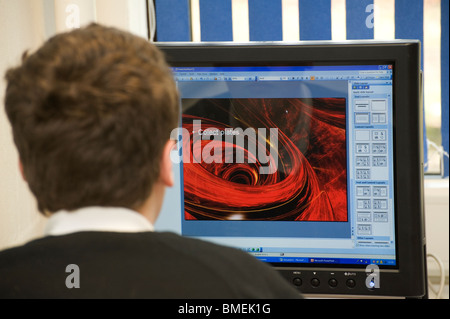 Child working on a computer in a school. Stock Photo