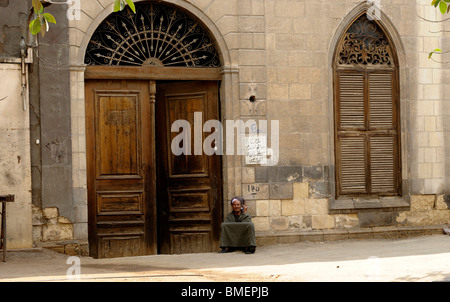 old man  sitting at the entrance to his house in the southern cemeteries, Cairo’s City of the Dead Stock Photo