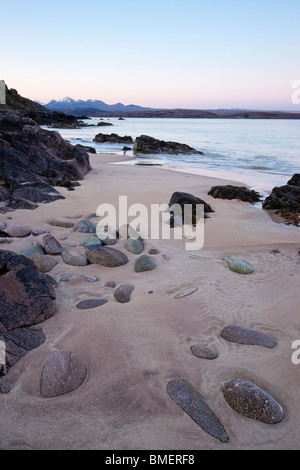 The beach at Big Sand, near Gairloch, Wester Ross, Highland, Scotland, UK. View to the mountains of Torridon at dawn. Stock Photo