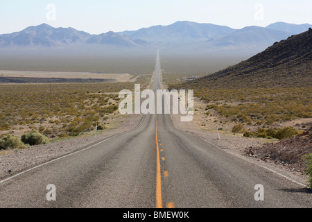 Endless straight desert highway in Death Valley, Nevada in the USA Stock Photo