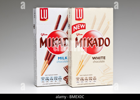 Two boxes of Mikado new white and milk chocolate biscuit sticks Stock Photo