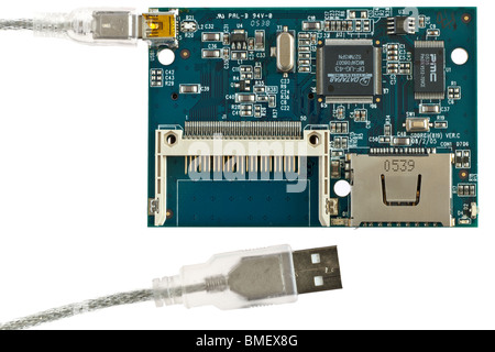 Inner pcb board workings on a multi card reader with Usb 2 to mini USB cable Stock Photo