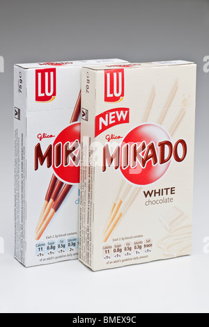 Two boxes of Mikado new white and milk chocolate biscuit sticks Stock Photo