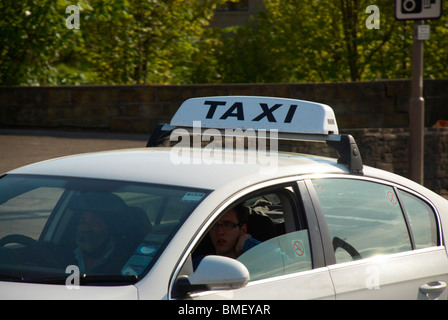 Taxi on the road in Huddersfield. Stock Photo